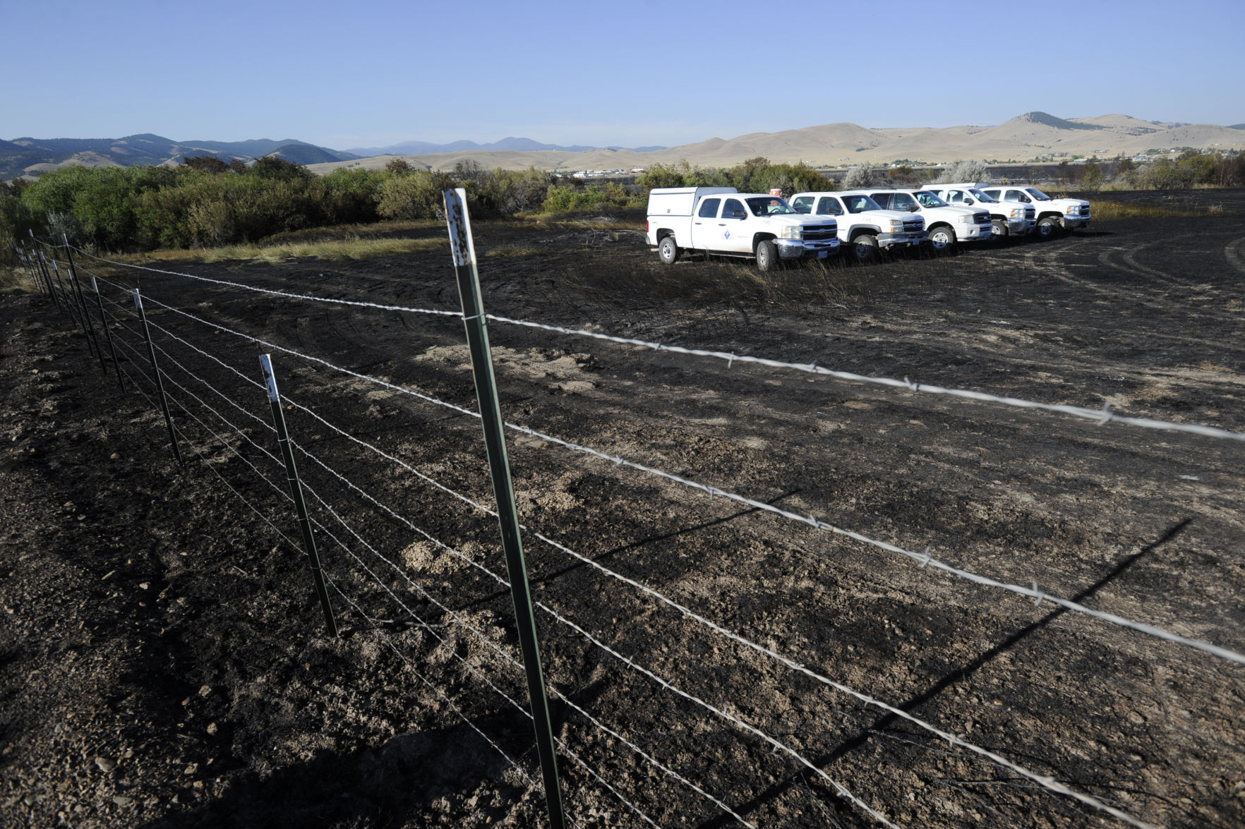 Firefighters mop up along Seven Mile Creek